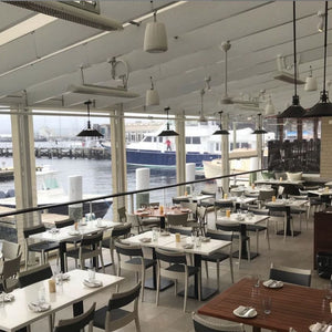 Bromic White Tungstan Electric Heaters Mounted Overhead in Restaurant