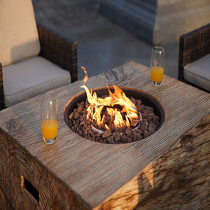 Beverages placed on the Direct Wicker 44-Inch Rectangular Tree Stump Propane Fire Pit Table