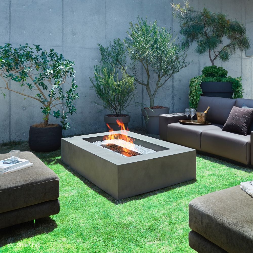 ecosmart fire wharf gray fire pit table on a patio