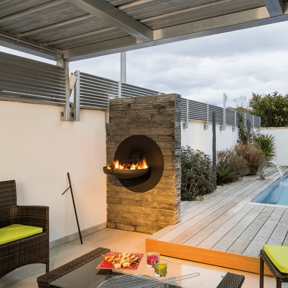 Focus Sigmafocus Wood Burning Fire Pit Grill in patio