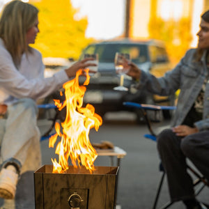Live Outdoor Firestorm Series I Free Standing Fire Pit being used in an outdoor gathering.