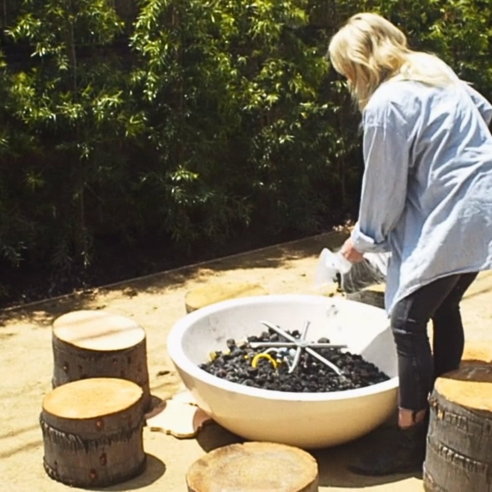 putting lava rocks on the white modern blaze gas fire bowl