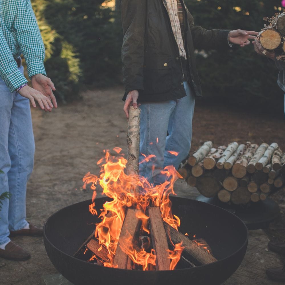 burning firewood on the seasons fire pits elliptical steel fire pit