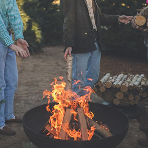 burning firewood on the seasons fire pits elliptical steel fire pit