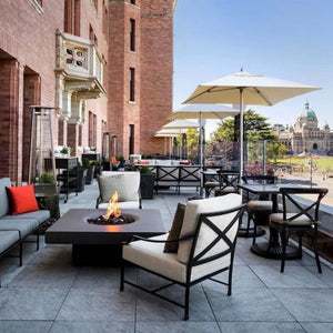 Solus Elevated Halo 48-Inch Square Gas Fire Pit at a cafe