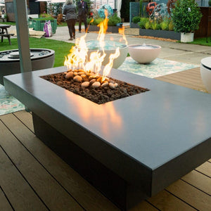 Solus Tavolo 68-Inch Linear Concrete Gas Fire Pit on a deck