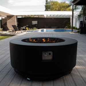 stonelum coliseo 1 round black fire pit on a patio
