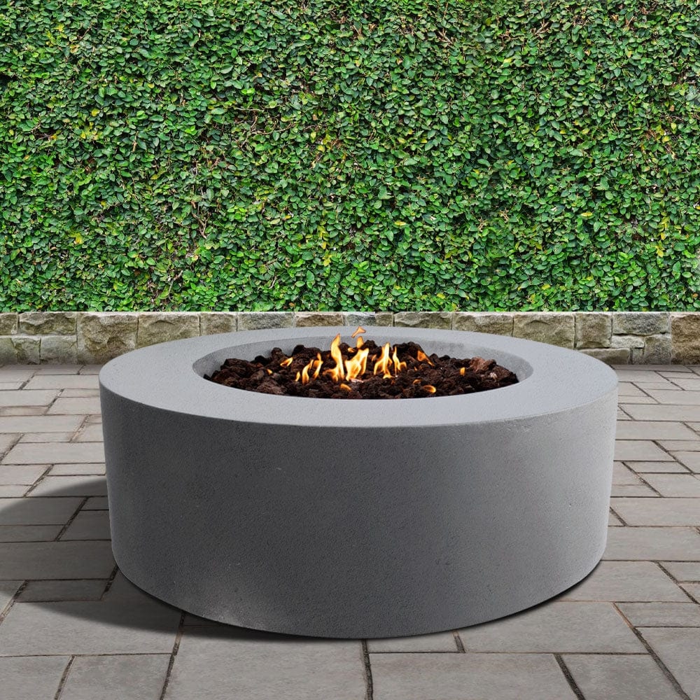 stonelum coliseo 1 round grey gas fire pit in a garden