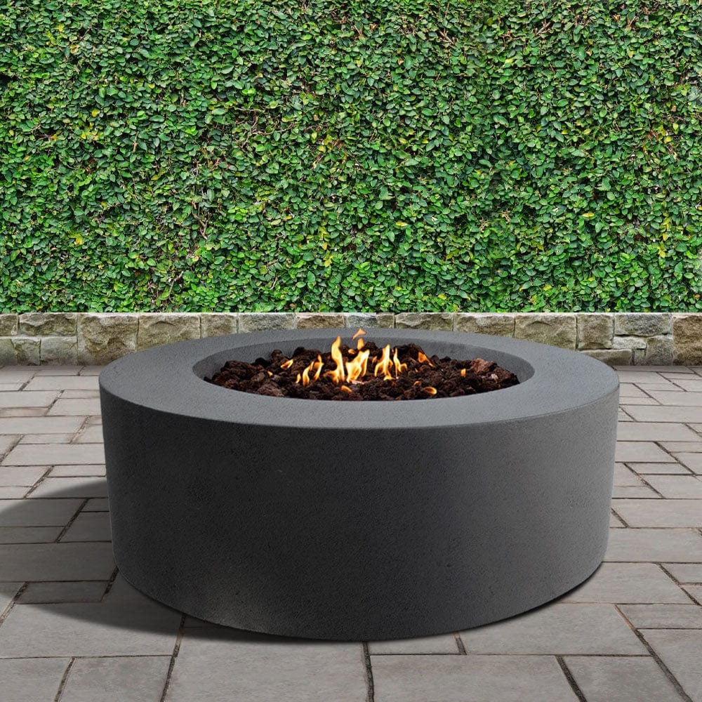 stonelum coliseo 1 round graphite gas fire pit in a garden