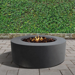 stonelum coliseo 1 round graphite gas fire pit in a garden