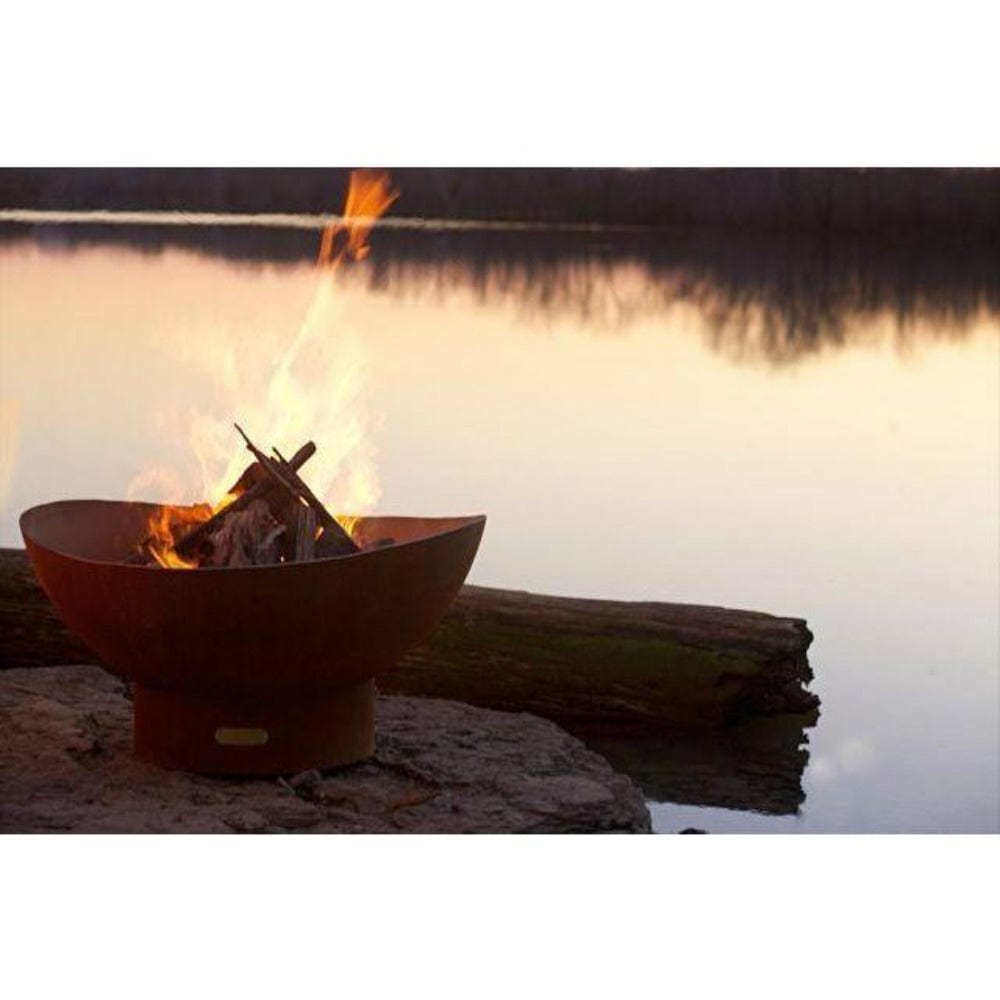 Fire Pit Art Scallop - 36" Handcrafted Carbon Steel Fire Pit Lit Up Beside A Lake