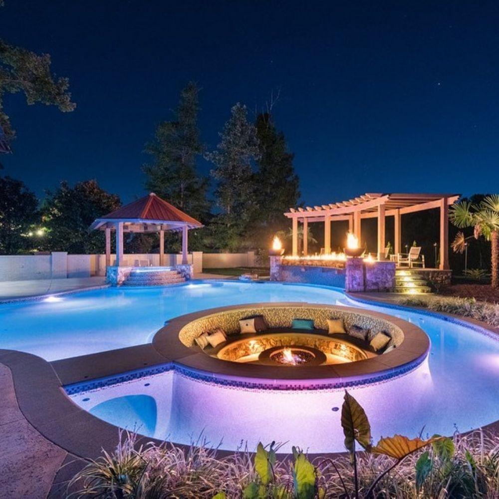 Firegear Sanctuary 30" Round Concrete Gas Fire Bowl in Poolside in the evening