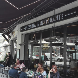 Heatscope Spot 35" Black Electric Heaters in Restaurant