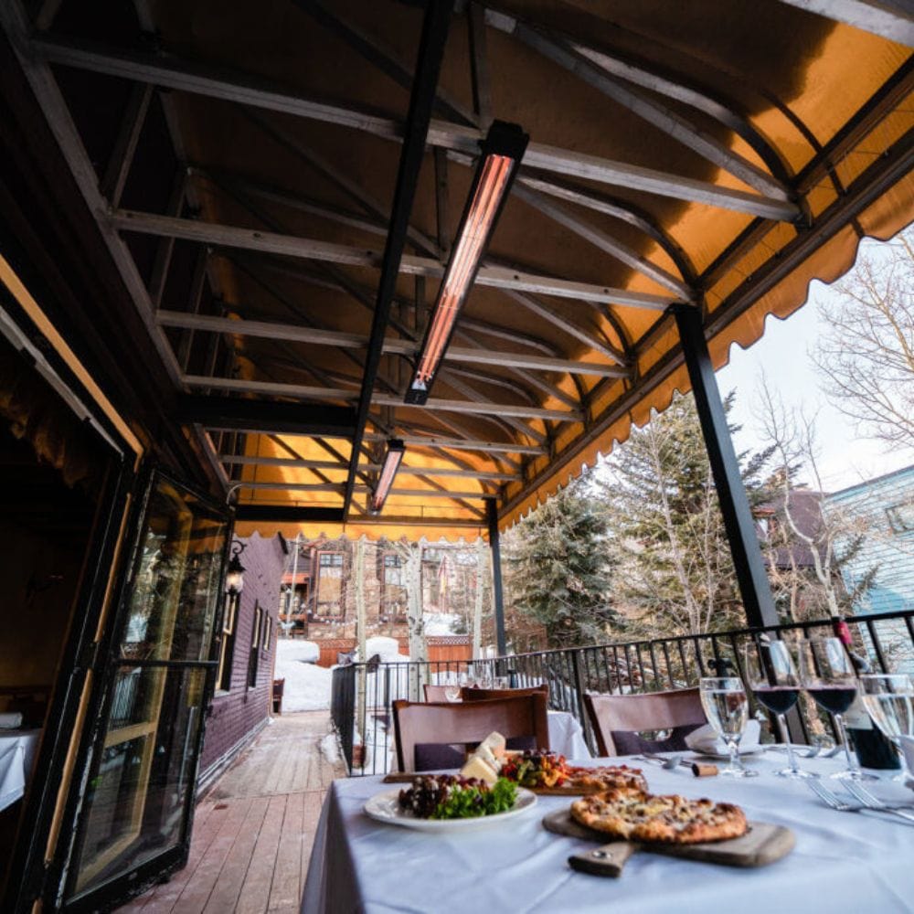infratech sl series 63" electric patio heater at a restaurant - lifestyle view