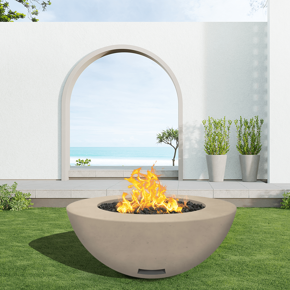 modern blaze round bone fire bowl with smooth surface in a light outdoor setting - angle view