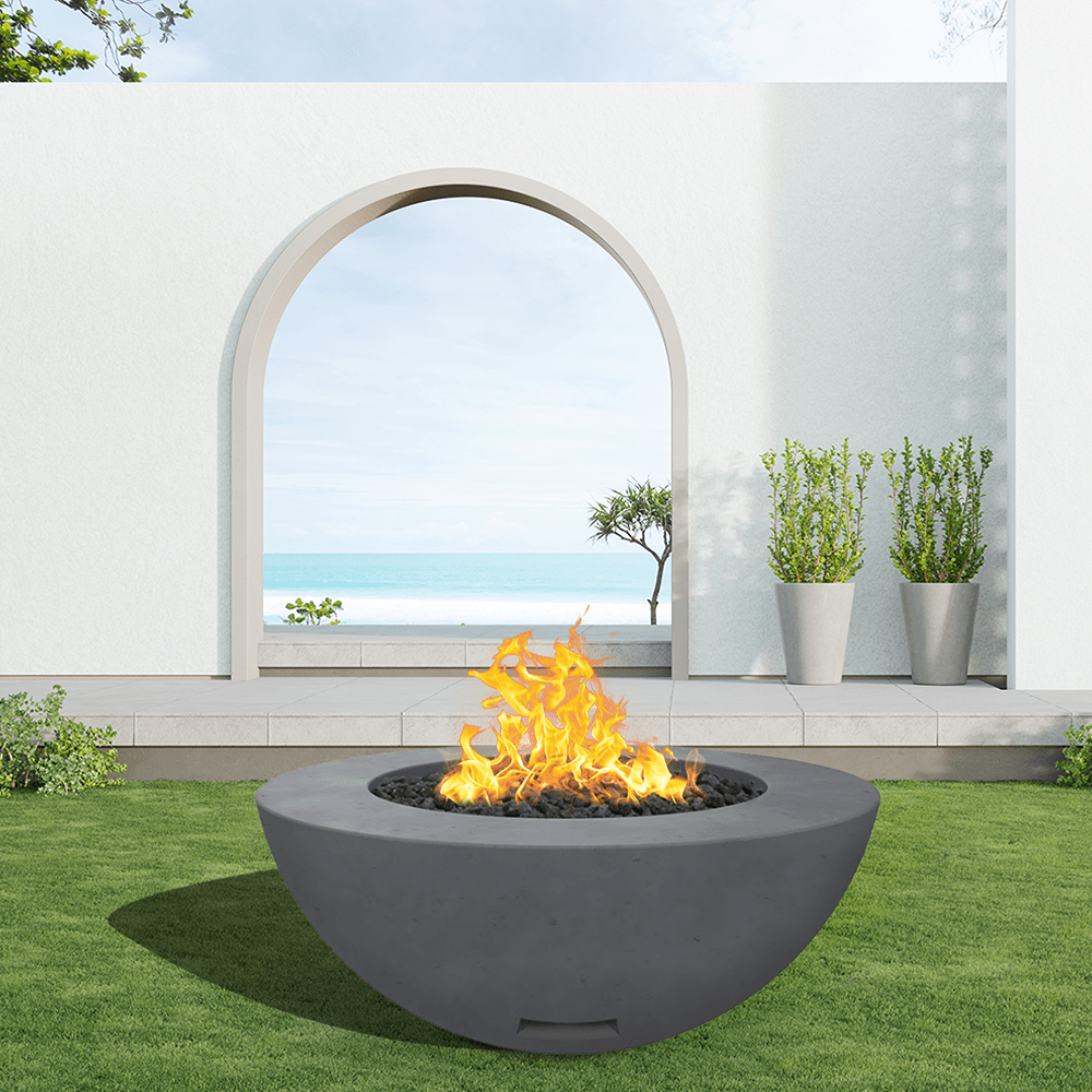 modern blaze round coal fire bowl with smooth surface in a light outdoor setting - angle view