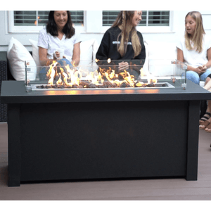 gathering around the Modern Blaze 54-Inch Linear Fire Pit Table