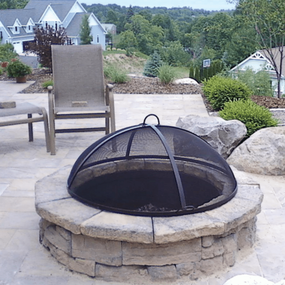 Modern Blaze Round Lift Dome Screen on Fire Pit in garden