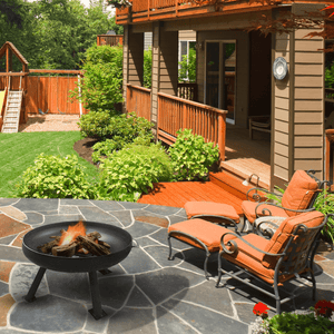 modern blaze round tripod steel fire pit in a backyard
