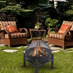 modern blaze round four leg base steel fire pit near patio chairs
