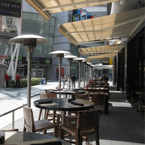 Sunglo A242 Portable Stainless Steel Natural Gas Heater lined up in a patio