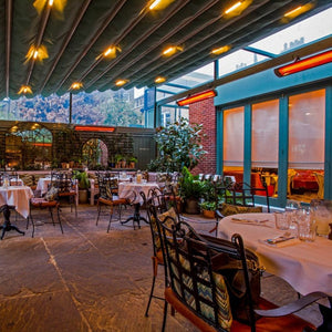 Black bromic tungsten smart-heat electric patio heater at a restaurant in california