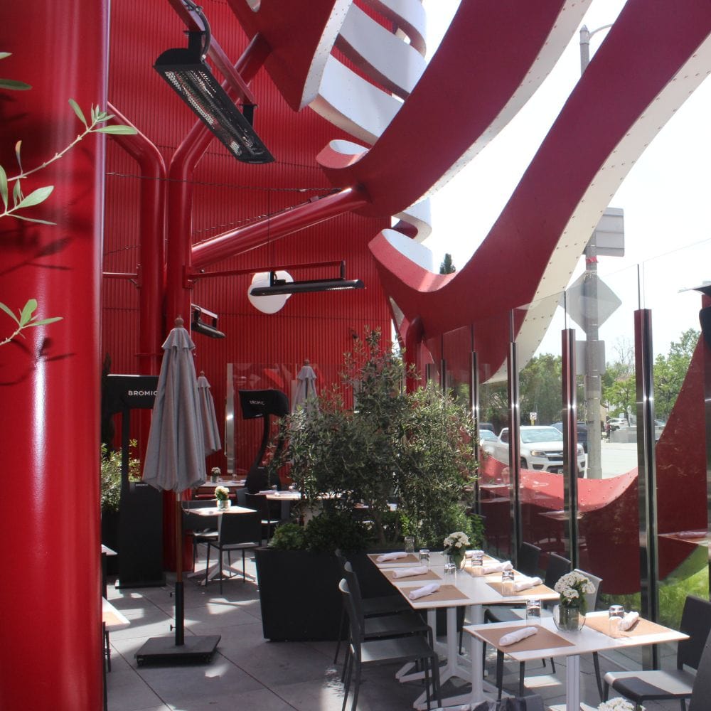 Bromic Tungstan Electric Heaters Mounted Overhead in Restaurant