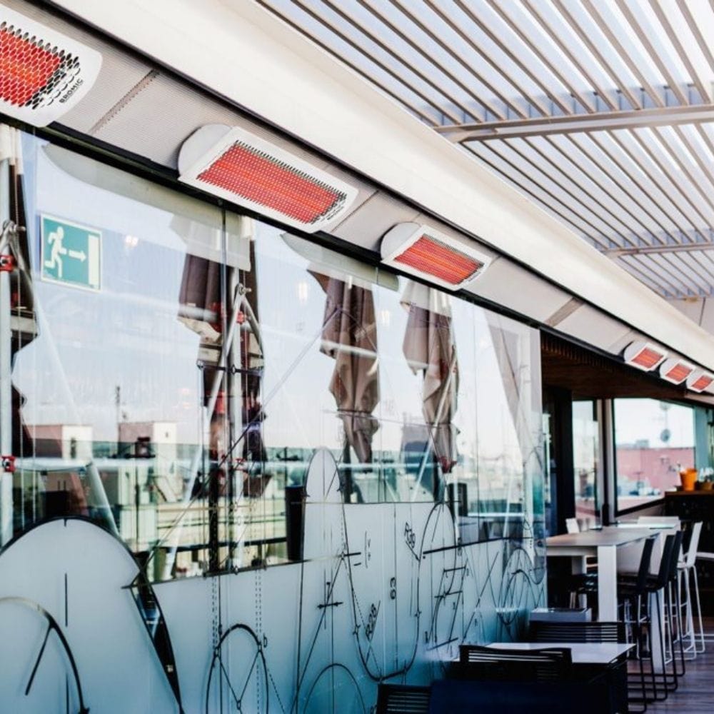 Bromic Tungsten Smart-Heat White Wall Mounted Electric Heaters in a Restaurant - angle view