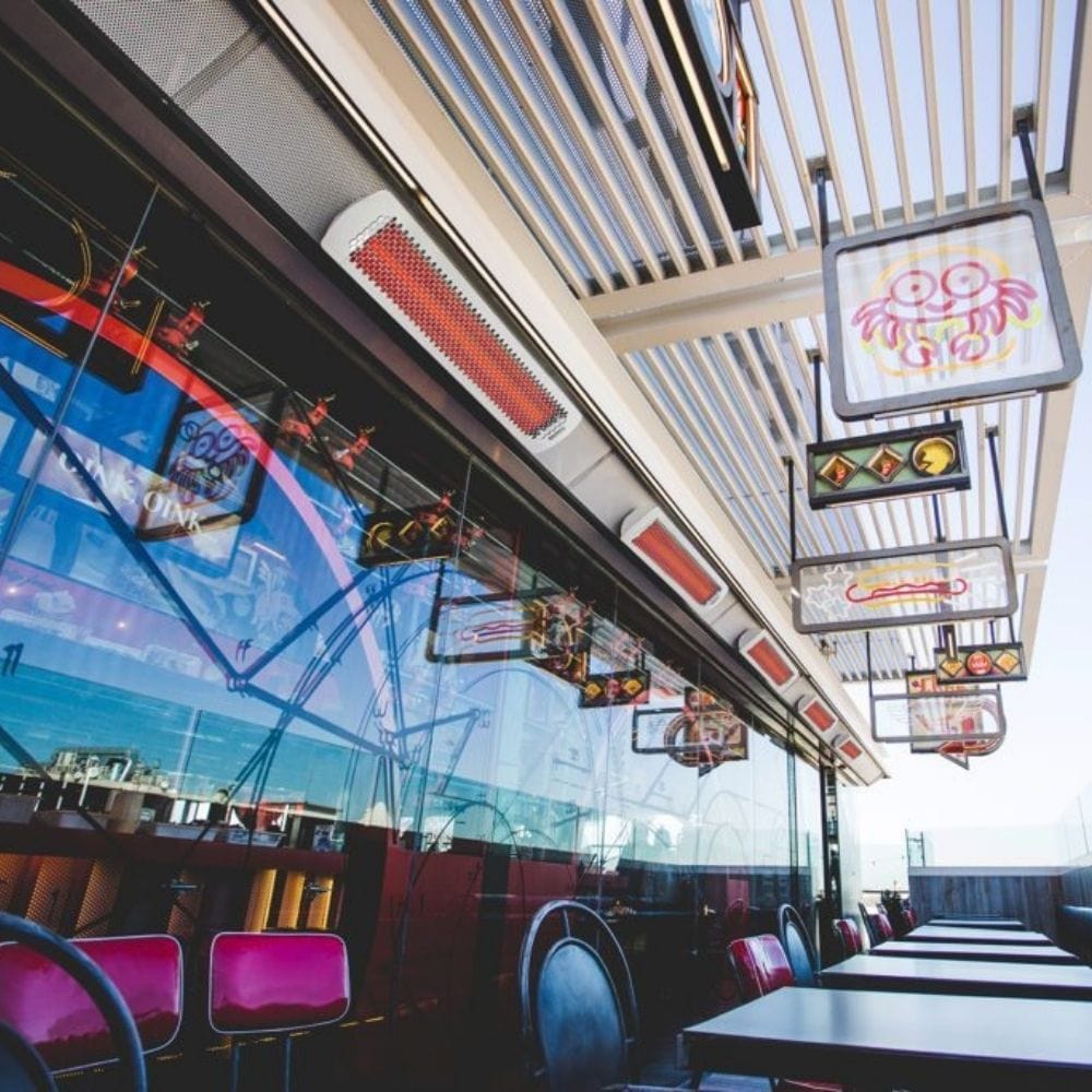 Bromic Tungsten Smart-Heat White Wall Mounted Electric Heaters in a Restaurant
