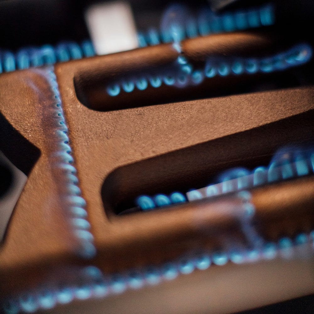 american made grills red brass burners turned on - angle view