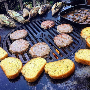 grilling patties on the arteflame one series fire pit