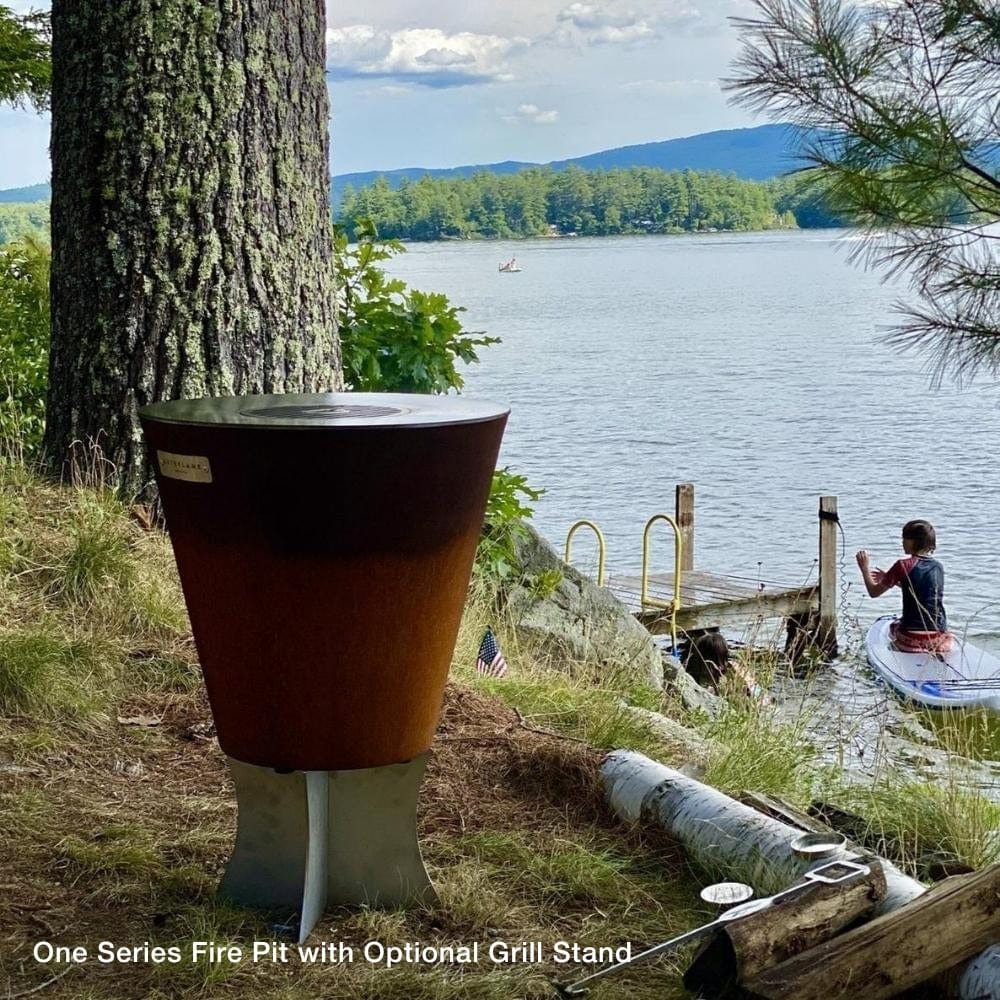 Arteflame One Series Fire Pits with grill stand by the lake - angle view