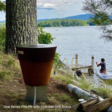 Arteflame One Series Fire Pits with grill stand by the lake - angle view