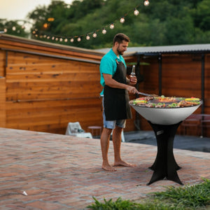 man grilling on an arteflame platinum grill with eurobase