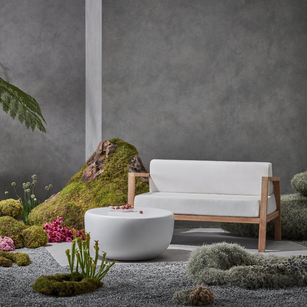 Blinde Design Sit L52 52-Inch Teak Wood Sofa Chair in a garden