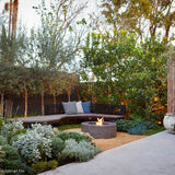 ecosmart fire ark gray fire pit table in a garden