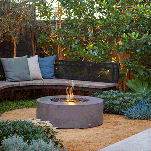 ecosmart fire ark gray fire pit table in a cozy outdoor space