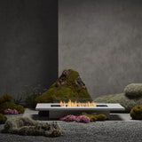 Daiquiri 70" Fire Pit Table in the zen garden
