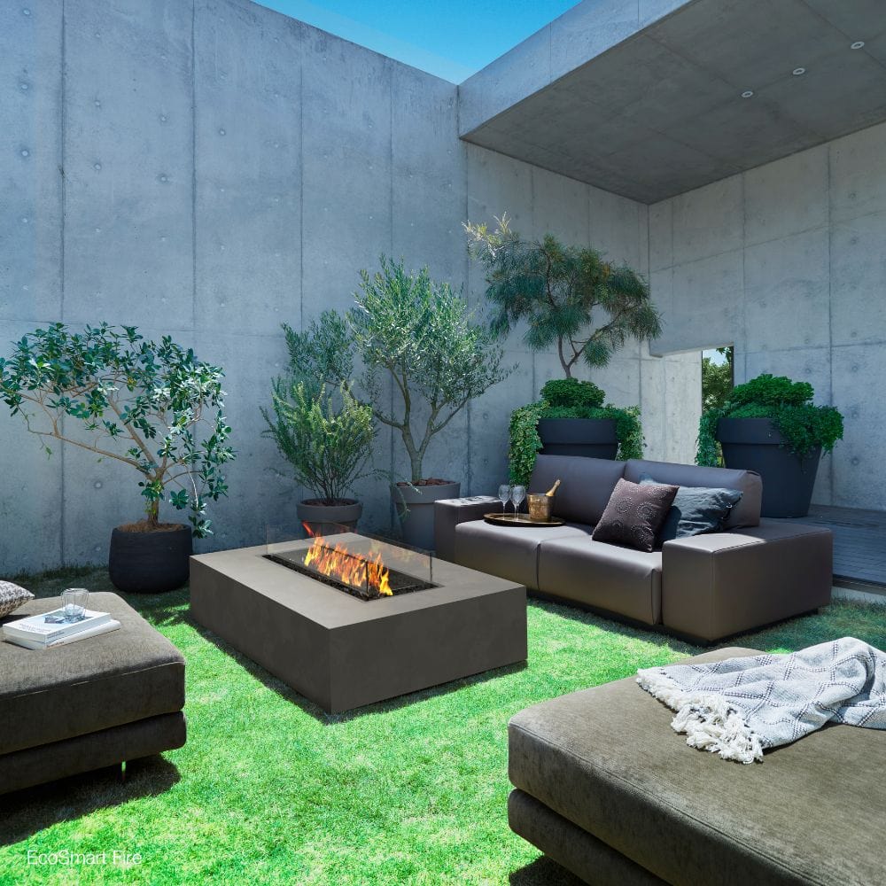 ecosmart fire wharf gray fire pit table in an outdoor space