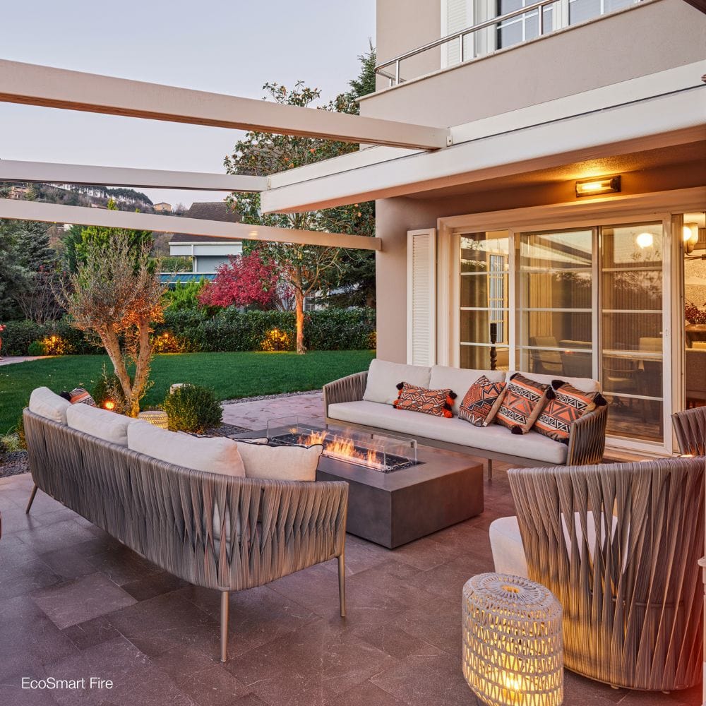 ecosmart fire wharf gray fire pit table in a garden