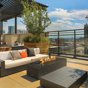 Fire Garden 132-Inch Linear Powder-Coated Steel Natural Gas Fire Pit at a rooftop