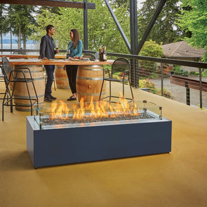 Enjoying a glass of wine by the Fire Garden 84-Inch Linear Natural Gas Fire Pit