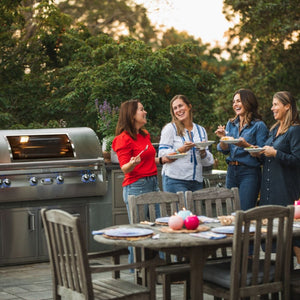 hosting a barbecue party with the fire magic grill