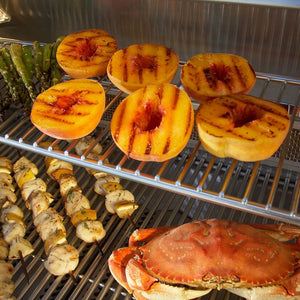 grilling pineapples, kebabs, and crabs on the Fire Magic Echelon Built-In Gas Grill 