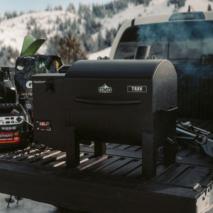 Green Mountain Grills Trek Prime 2.0 Pellet Grill behind pickup truck