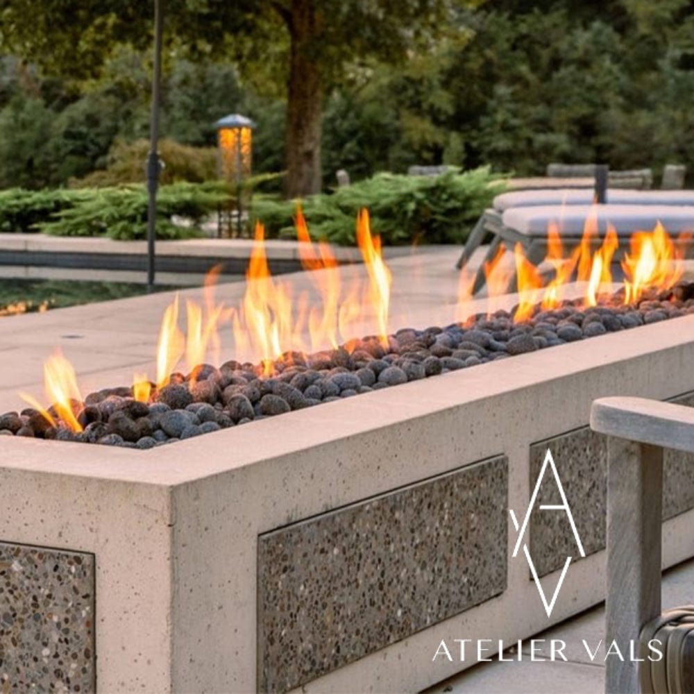 HPC Linear Trough Gas Fire Pit Insert installed on a concrete fire pit with stucco tiles - side view