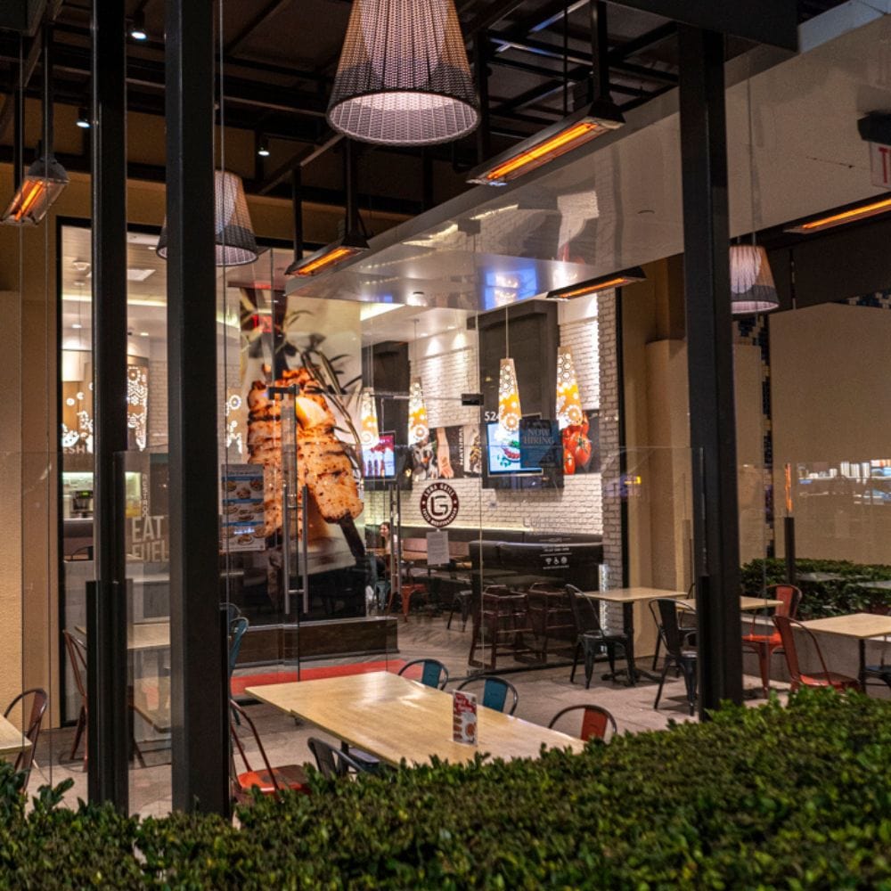 Infratech WD Series 39" Dual Element Electric Heater at a restaurant patio at a restaurant - angle view