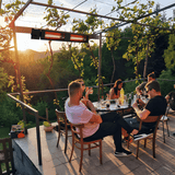 King Electric SmartWave Infrared Radiant Patio Heater is installed at a patio dining gathering. - detail view