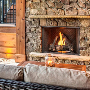 majestic courtyard fireplace with herringbone interiors on a beautiful stone wall