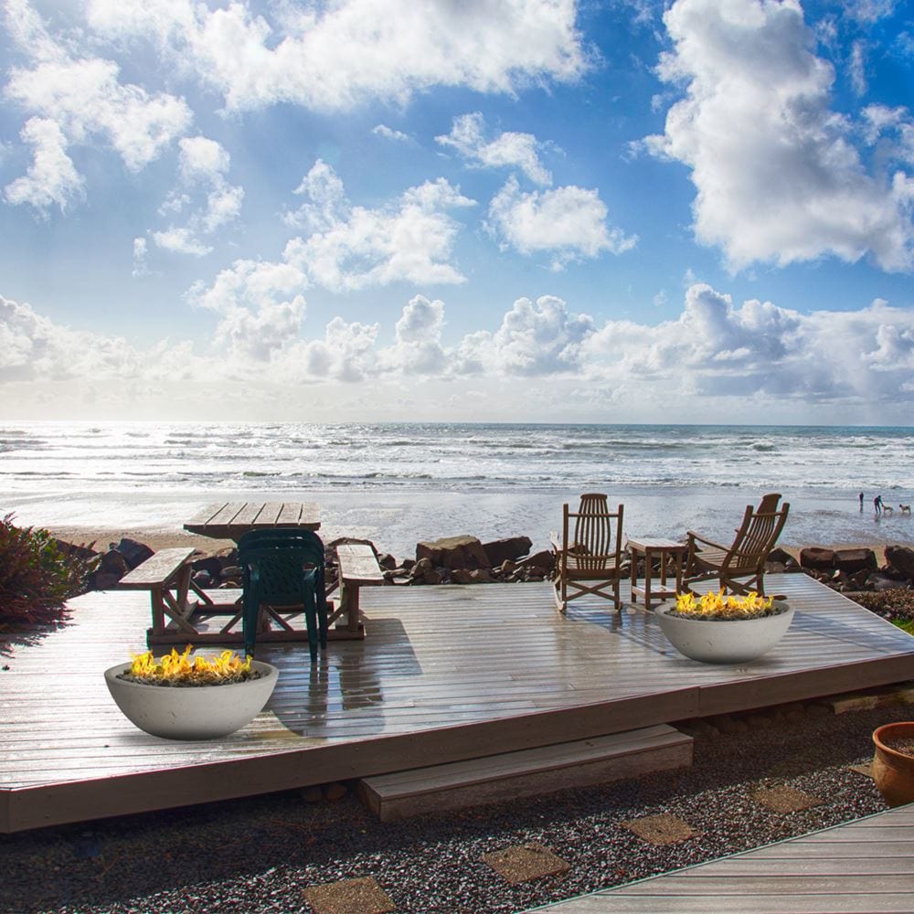modern blaze wok off white gas fire bowl on a beautiful patio overlooking the beach